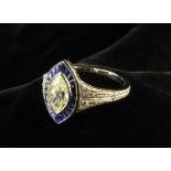 An 18 Carat White Gold Diamond & Sapphire Dress Ring.