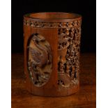 An Antique Oriental Carved Bamboo Brush Pot of cylindrical form 7" (18 cm) in height.