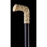 A 19th Century Ebony Walking Stick with a Cantonese ivory handle intricately pierced & carved with