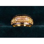 A Fine Regency Period Gold & Black Enamel Memorial Ring with a woven hairwork panel set to the