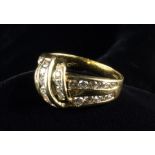 An 18 Carat Yellow Gold & Diamond Knot Ring.