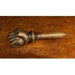 A Vintage Treen Nut Cracker carved in the form of a hand clasping the nut receptacle with a