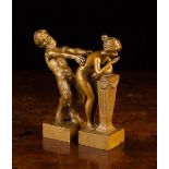 A Pair of Golden Brown Patinated Bronze Erotic Figures: A Satyr & Nymph, 4½" (11.5 cm) in height.