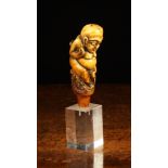 A 19th Century Indonesian Figural Walking Stick Handle carved from mammoth ivory,
