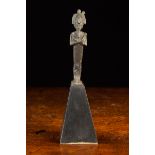 A Egyptian Bronze Osiris Amulet, late dynasty, mounted on an ebonised pyramidal pedestal,