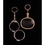 A Pair of Lorgnettes and a gilt metal magnifying glass.