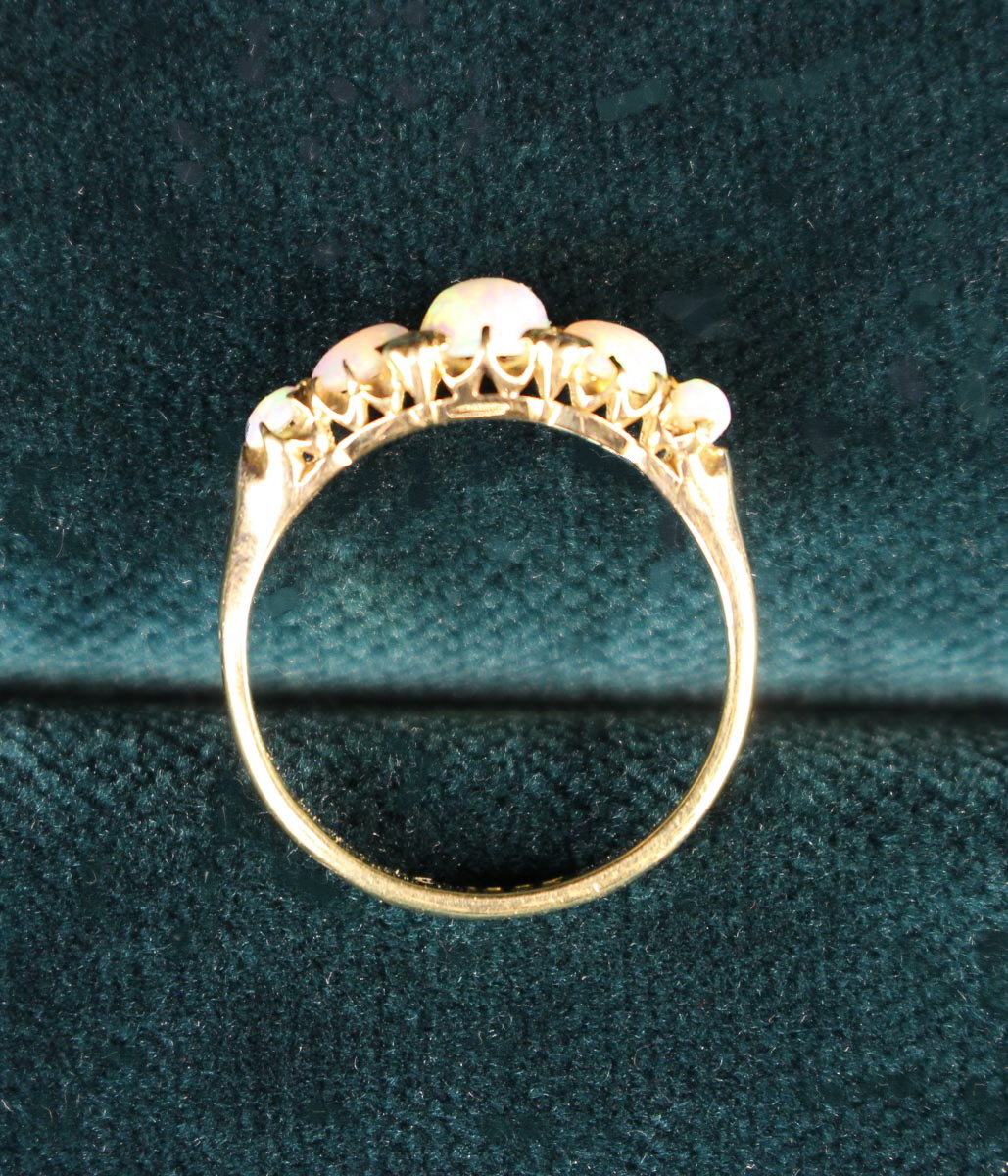 A Lady's 18 Carat Yellow Gold Ring set with five opals and four small diamonds flanking the central - Image 5 of 5