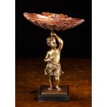 A 19th Century Bronze Tazza cast in the form of a cherub holding a painted shallop shell dish on