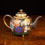 A Small Fine Quality Cloisonné Teapot ornamented with roundel of flowers and foliage on a black