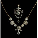 A Pretty Edwardian Pendant set with pale blue & white stones encircled by seed pearls,
