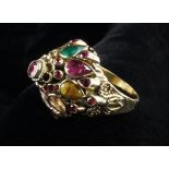 An 18th Carat Yellow Gold Marharja Ring set with Rubies, and teardrop petals of rubies, sapphire,