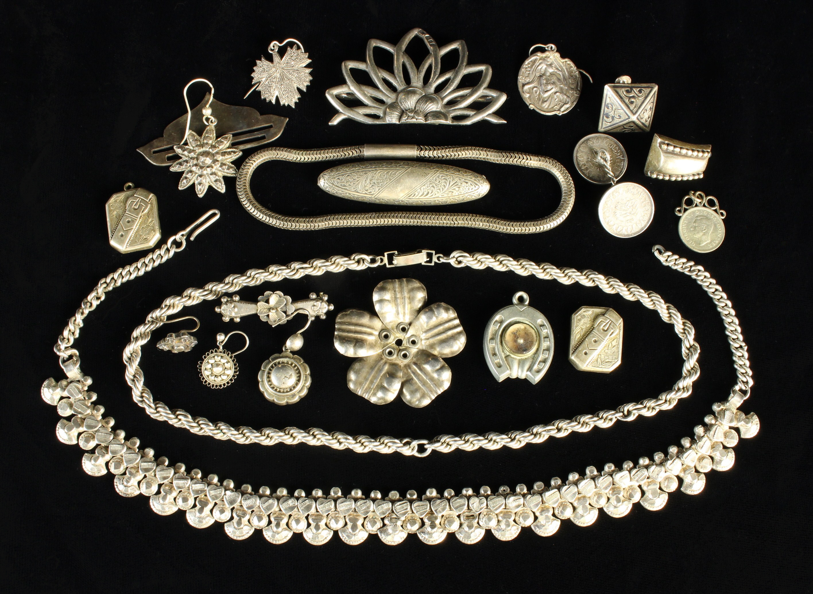 A Collection of Mostly Silver Vintage Jewellery to include two necklaces, nine odd earrings,