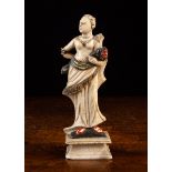 An Antique Sicilian Carved & Painted Alabaster Statuette of a Lady holding a rose,