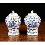 A Pair of Small Chinese Blue & White Baluster Vases with covers,
