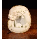 A Fine 18th Century Qing Dynasty Chinese Pale Celadon Jade Pebble Carving with dark inclusions to