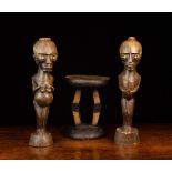 A Small Painted African Stool and Two African Figures 14½" (37 cm) high.