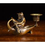 A Figural Bronze Candleholder.