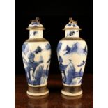 A Pair of 19th Century Blue & White Japanese Arita Baluster Vases with domed lid surmounted by dogs