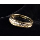 An 18 Carat Gold & Diamond Half Eternity Ring.