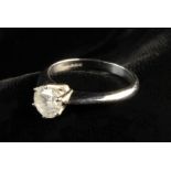 An 18 Carat White Gold Solitaire Diamond Ring. The round brilliant cut stone measuring 6.