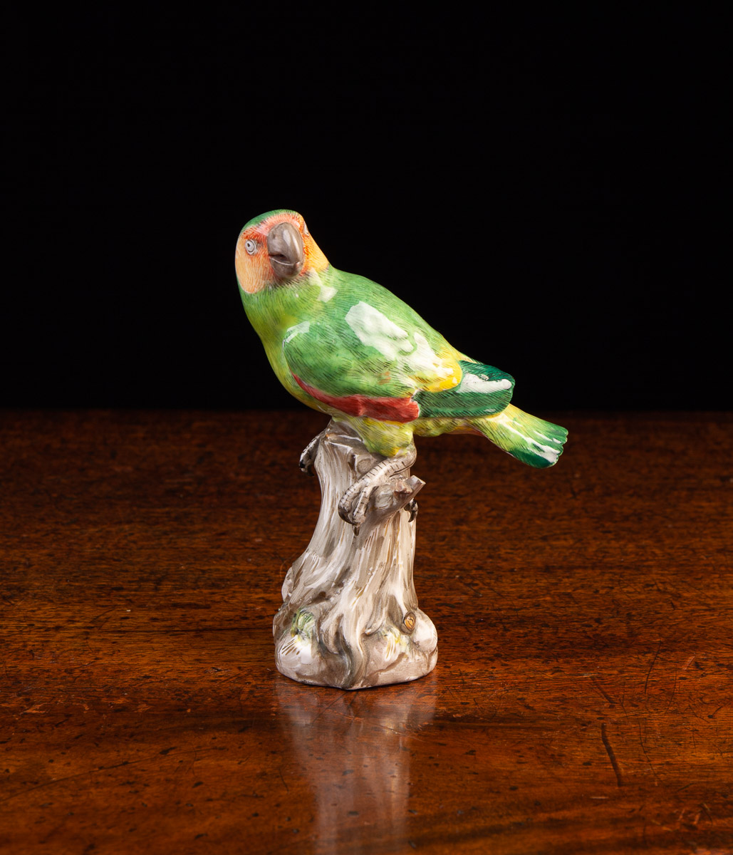 A Meissen Porcelain Model of a Parrot perched on a tree stump,