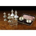 A Group of Silver Condiments: A pair of salts with spoons in fitted case with hallmarks