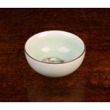 A Miniature Chinese Celadon glazed porcelain bowl with two moulded carp to the bottom, 2¾" (7.