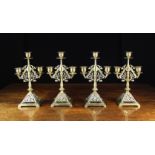 A Set of 4 Victorian Aesthetic Movement Brass two-branch Candelabra.