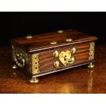 A Late 17th Century Dutch Colonial (Batavia) Casket of Coromandel with heavy gilt brass mounts.