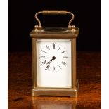 A Small Brass Carriage Clock, 5½" (14 cm) in height.