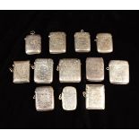 A Group of Twelve Silver Vesta Cases all engraved with foliate decoration and inscribed with