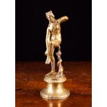 An Antique Renaissance Style Cast Brass Statuette of Venus standing on a round scotia base 7½" (19