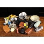 A Collection of Seven Old Flash Bulb Holders and various flash bulbs.