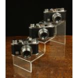 Three Early 1960's Vintage 35 mm Halina 35X Cameras; all Empire made with original cases.