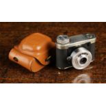 A Vintage German Sub Miniature Camera "Petie" by Walter Kunik Circa 1956, having a 35 mm f 1.