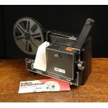 A Boxed Standard 8/Super 8 Duo-100 Film Projector with instructions, reel,