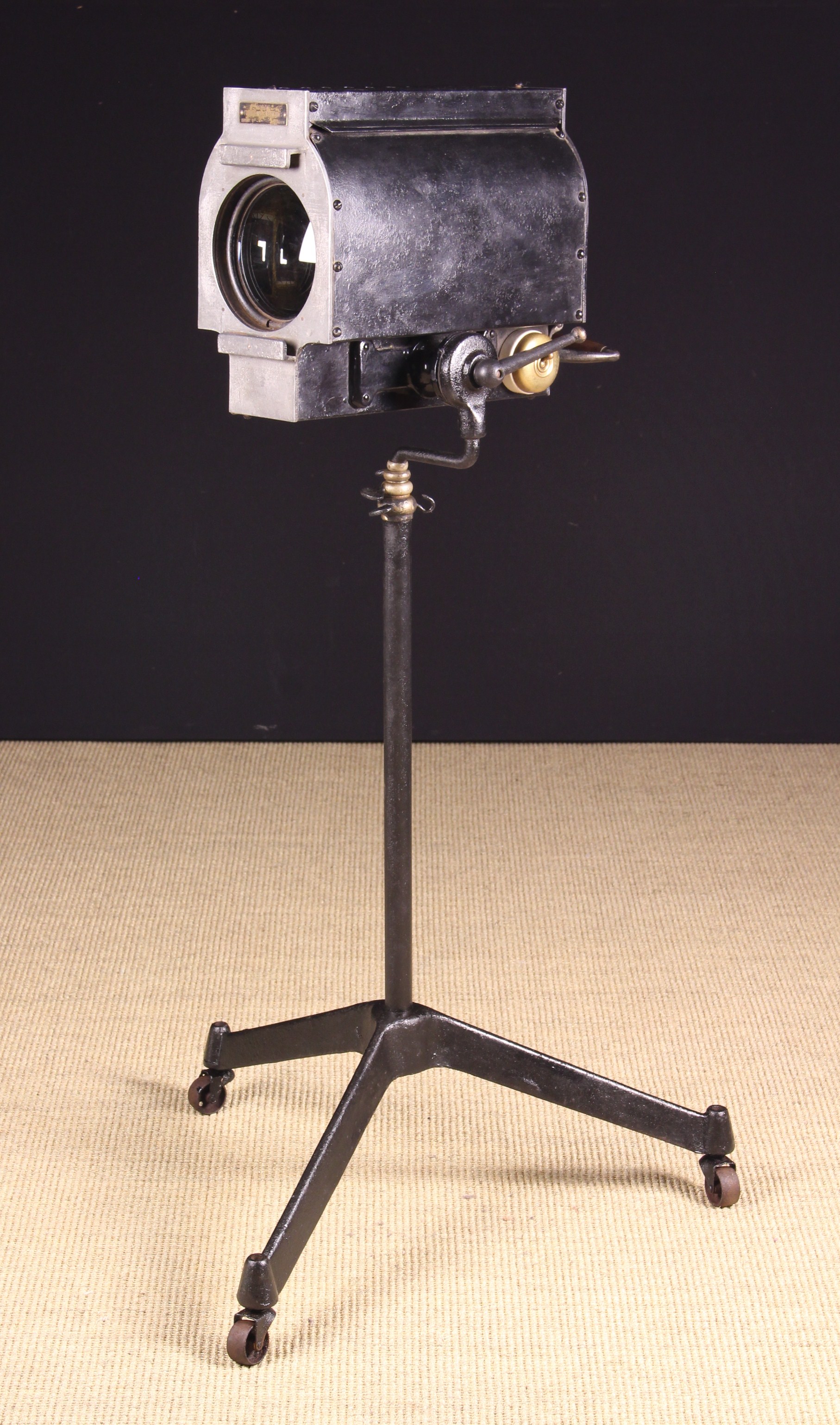 An Antique Photographer's Focussing Spotlight with turned wooden handle to the back and a metal