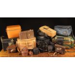 A Collection of Old and Used Camera Bags and straps.