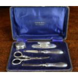 A Silver Manicure Set hallmarked Birmingham 1918 and stamped with maker's initials S.M.L.