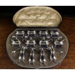 A Fine Cased Twelve-piece Silver Condiment Set comprising of four pepper pots,