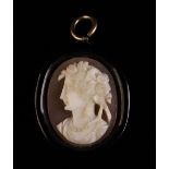 A Victorian Oval Jet Pendant inset with a carved shell cameo depicting bust of a lady,