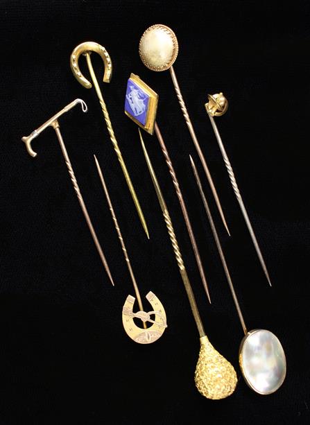 A Collection of Eight Gold Stickpins.