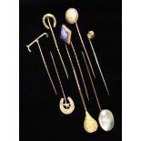 A Collection of Eight Gold Stickpins.