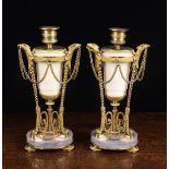 A Pair of Louis XVI Ormolu, Carrara & Grey Marble Candlesticks.