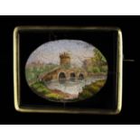 A Fine Micro-Mosaic Brooch of rectangular form inlaid with an oval scenic panel depicting a castle