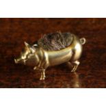 An Antique Brass Alloy Pen Wipe in the form of a Pig with brush insert to it's back, 2½" (6.