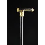 A 19th Century Ebony Walking Stick with horn handle and gilt metal mounts.