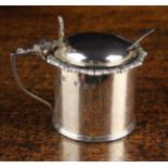 A Scottish Silver Mustard Pot with blue glass liner and hinged lid hallmarked Edinburgh 1904 and
