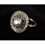 An Impressive Antique Diamond and Sapphire Ring. The central cushion cut, approx.