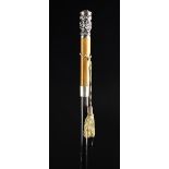 A Colonial Malacca & Ebony Walking Cane with white metal handle elaborately embossed and chased